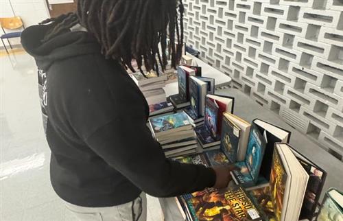 a student looking at books